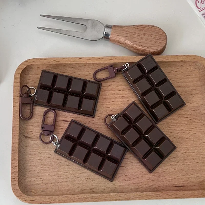 Pendentif de téléphone de sac unique ; Porte-clés de nourriture au chocolat délicieux simulé ; Porte-clés emblème idéal pour cadeau d'affaires