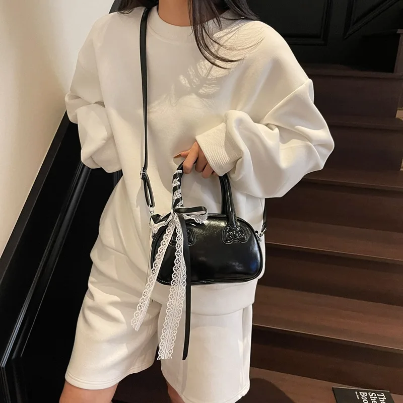 Torba damska wersja koreańska stylowa przenośna torba na poduszkę damska Superior Sense prosta koronkowa słodka torba na ramię typu crossbody urocza torba z kokardką