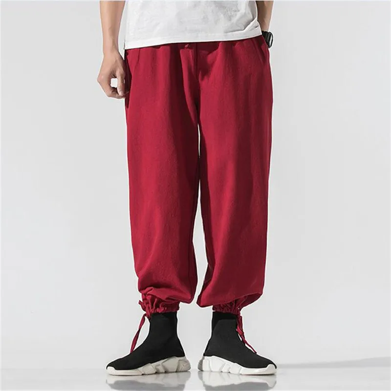 Plus größe Männer Jogger baumwolle Leinen Hosen Männer Lose Beiläufige Elastische taille Schwarz Grau weiß street Hosen große größe 5XL 6XL 7XL