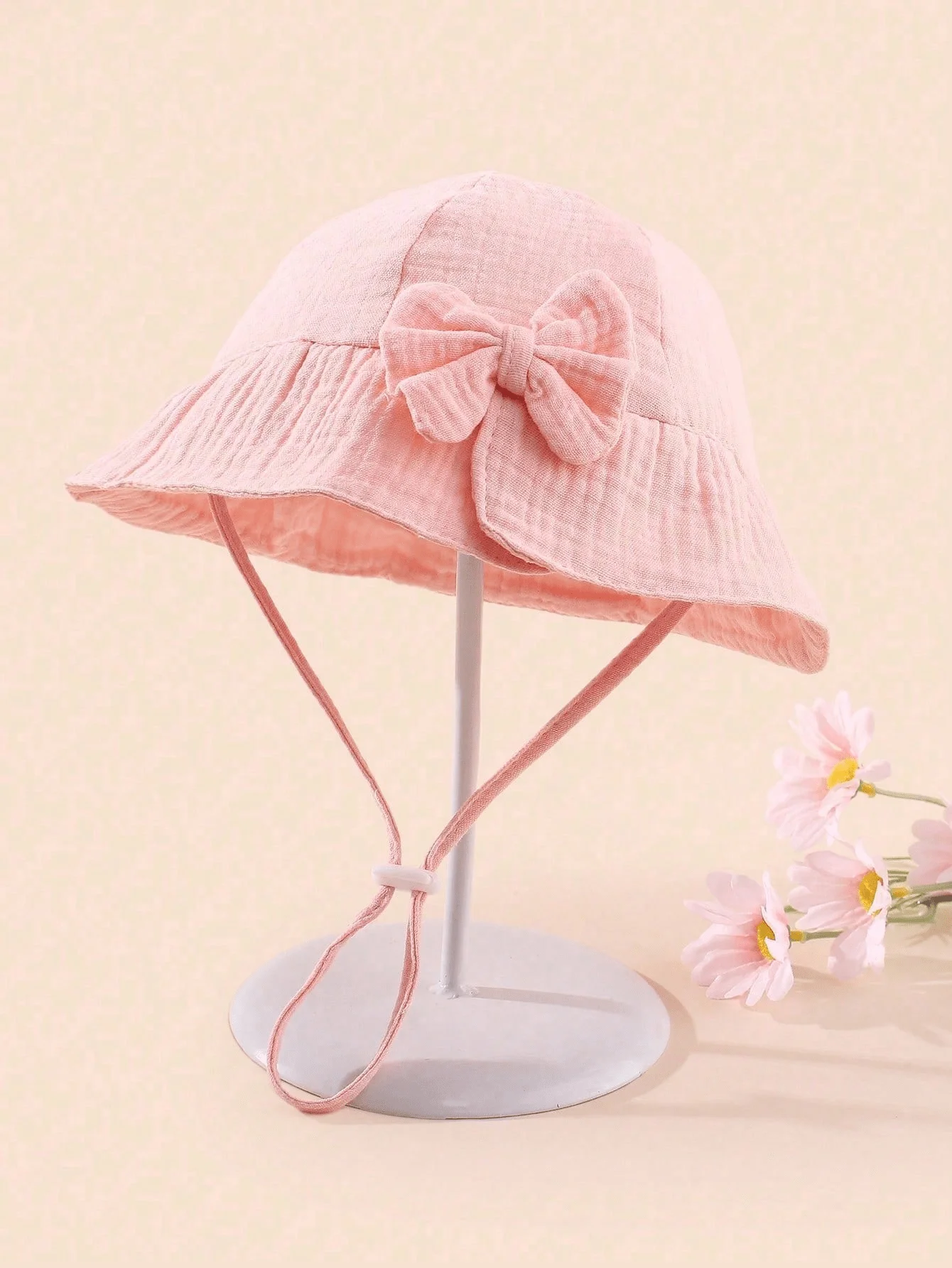 

Soft Pink Breathable Bucket Hat With Bow Detail And Adjustable Chin Strap For Warm Weather Use
