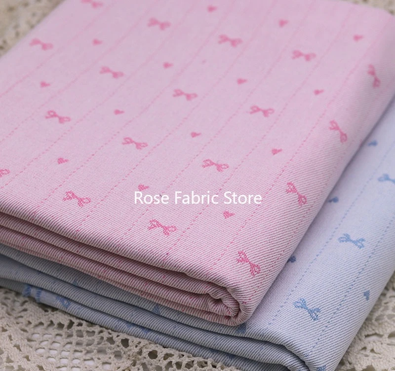 

1 meter delicate blue pink bow-embroidered jacquard denim fabric, striped clothing fabric for skirts, pants, hair accessories.