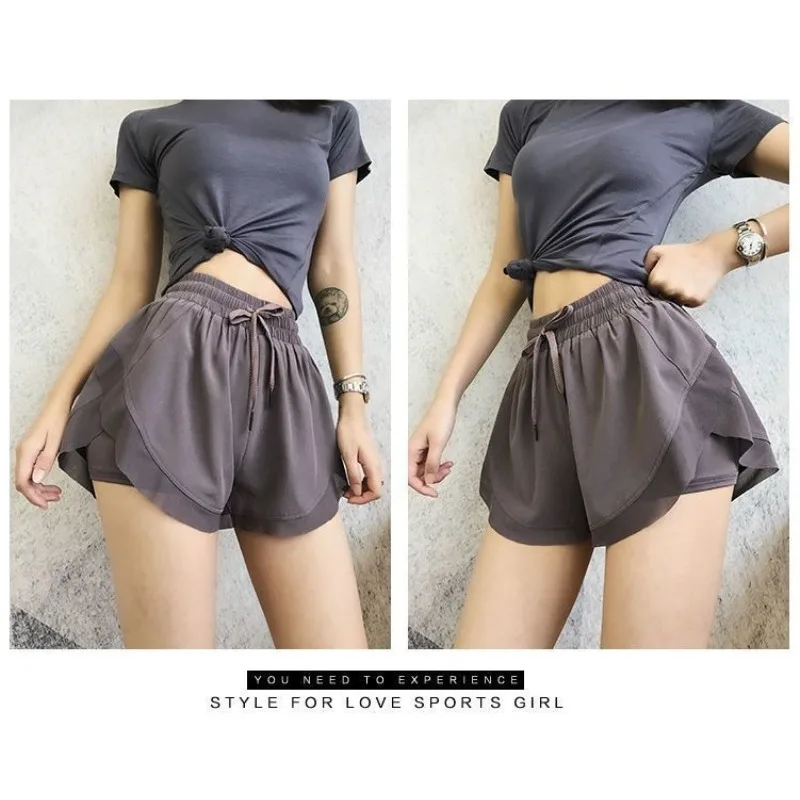 Shorts esportivos femininos de verão, calças soltas de ioga casuais discretas com cobertura de carne