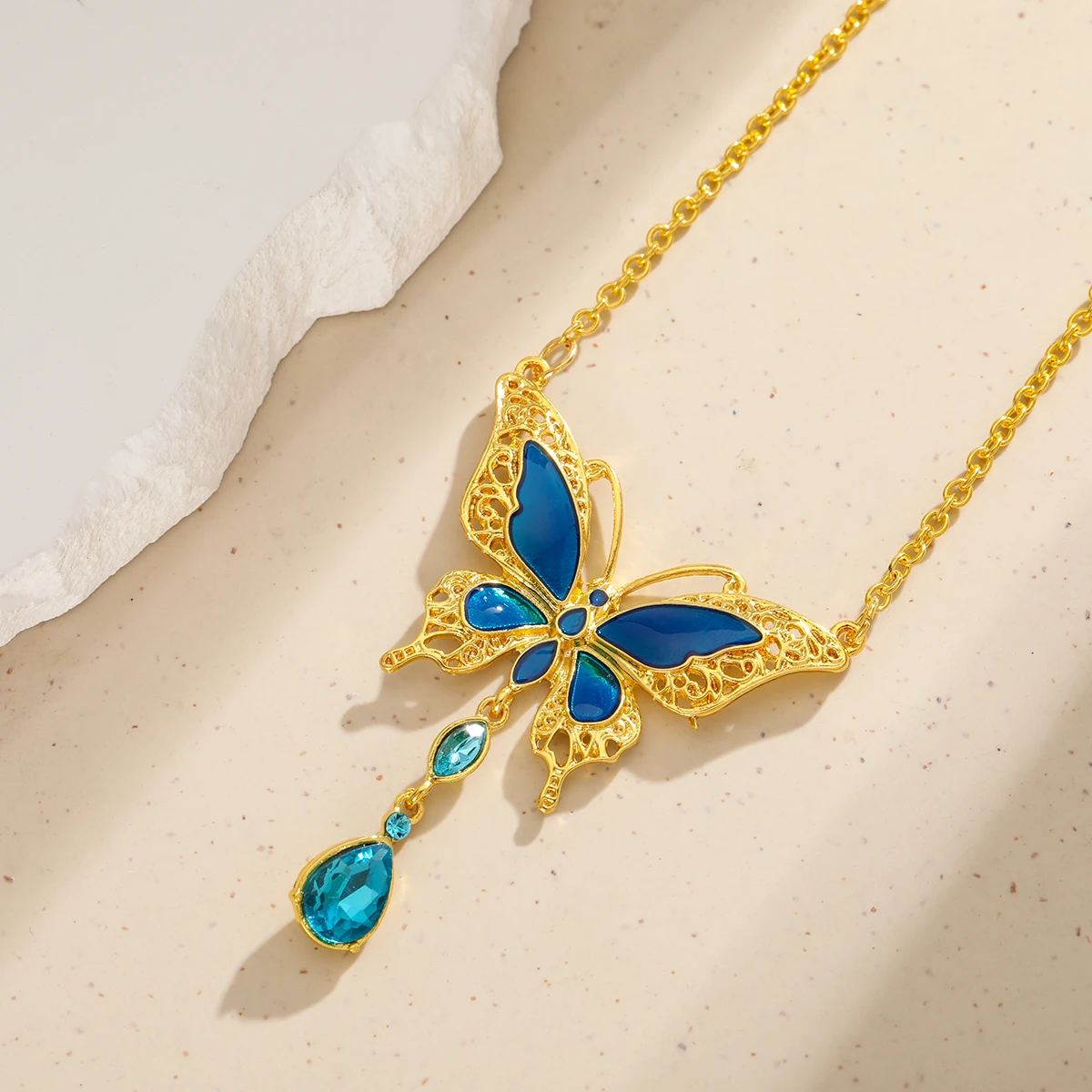 Elegant hollow flower wire butterfly with multi-layer blue artificial gemstone ladies' pendant earrings for formal occasions