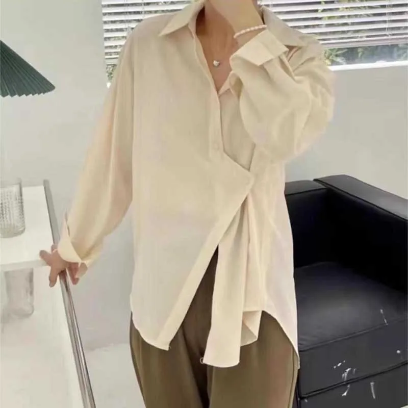 Fashion Lapel Button Solid Color Asymmetrical Shirts Women Clothing 2024 Spring Summer New Loose Casual Tops Irregular Blouses