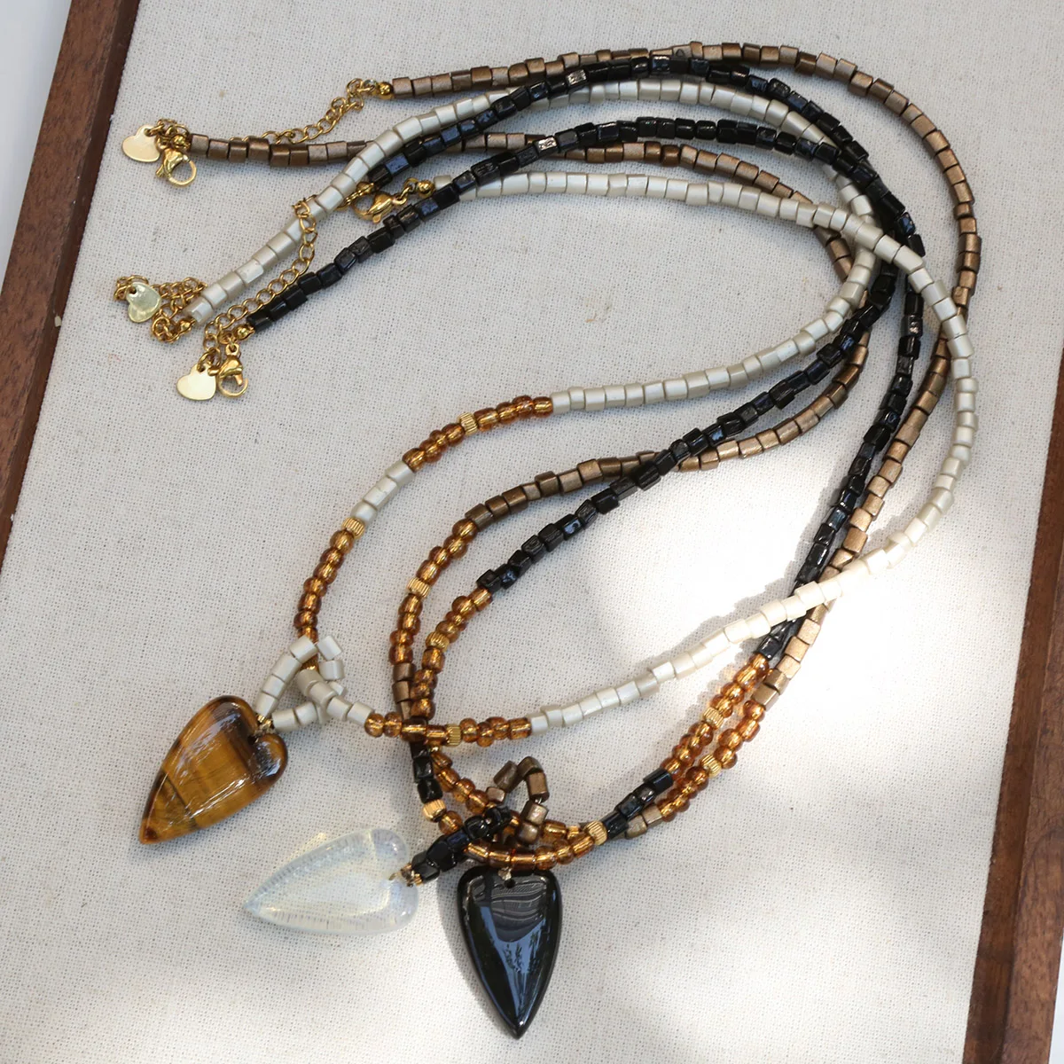 Retro Maillard color heart necklace for women 2025 new unique design sweater chain niche versatile long sweater chain