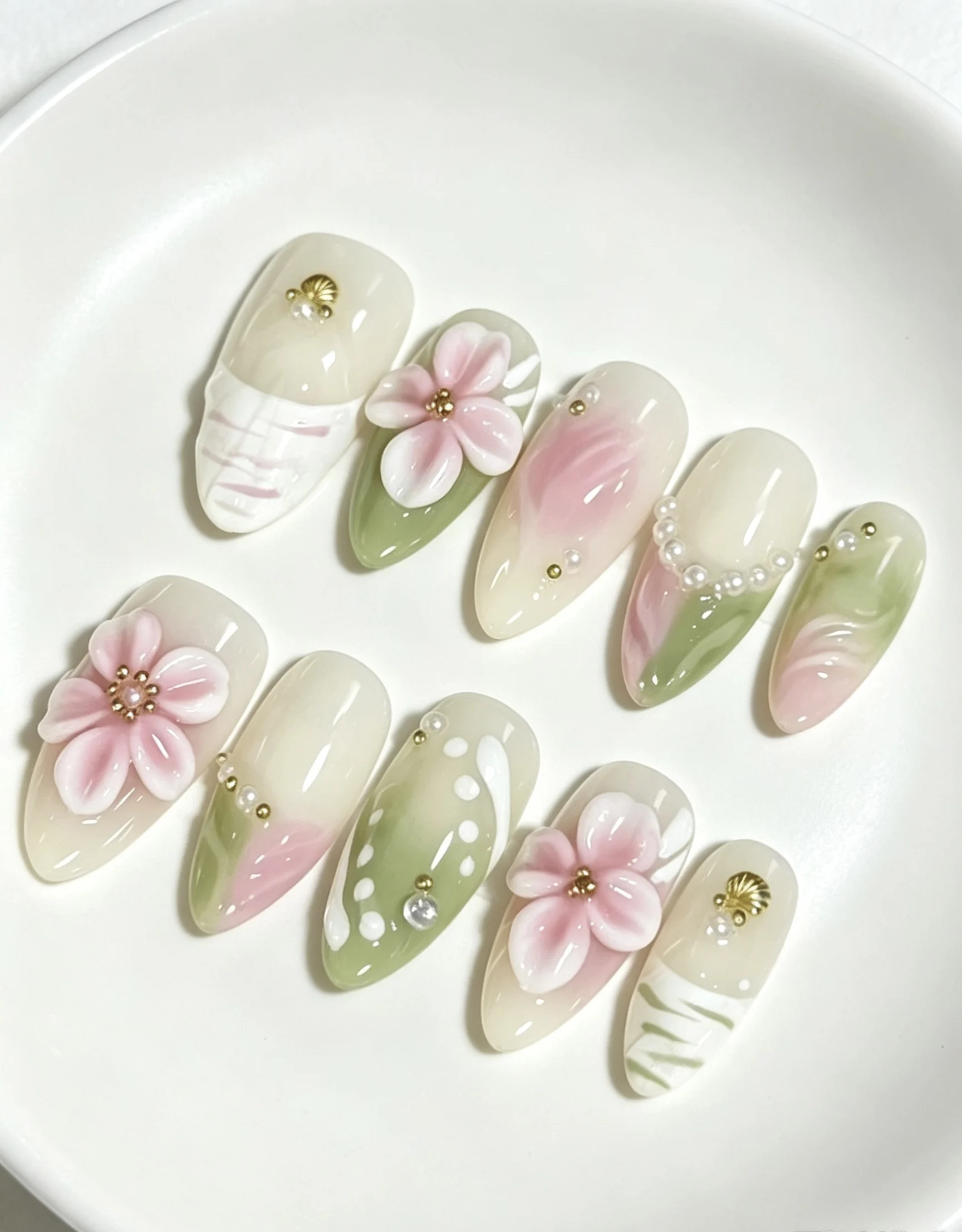 10 Pieces of Almond-Shaped Nails with a Milky Apricot Base Color, Blended with Soft Pink and Lime Green, Gently Blended with Three-Dimensional Peach Blossom and Almond Designs, and Come with Jelly Glue and a File