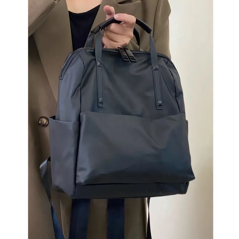 

Waterproof Nylon Backpack, New Trendy Travel Backpack, Fashionable and Versatile, Portable and Light Commuter Schoolbag.