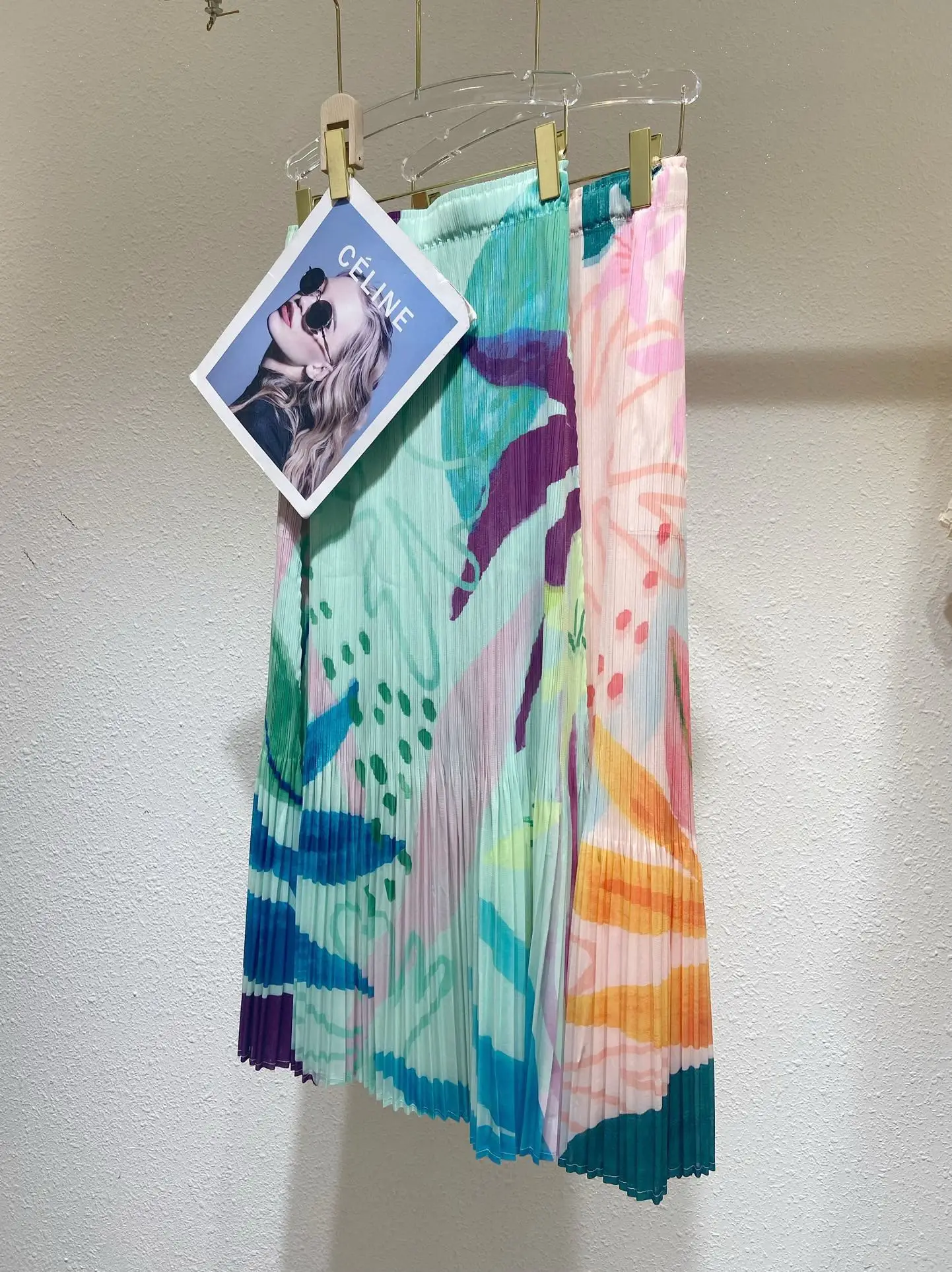 Mezza gonna stampata a pieghe Miyake 2025 Estate Nuova gonna a trapezio con sensazione premium Mezza gonna casual stile piccola fragranza