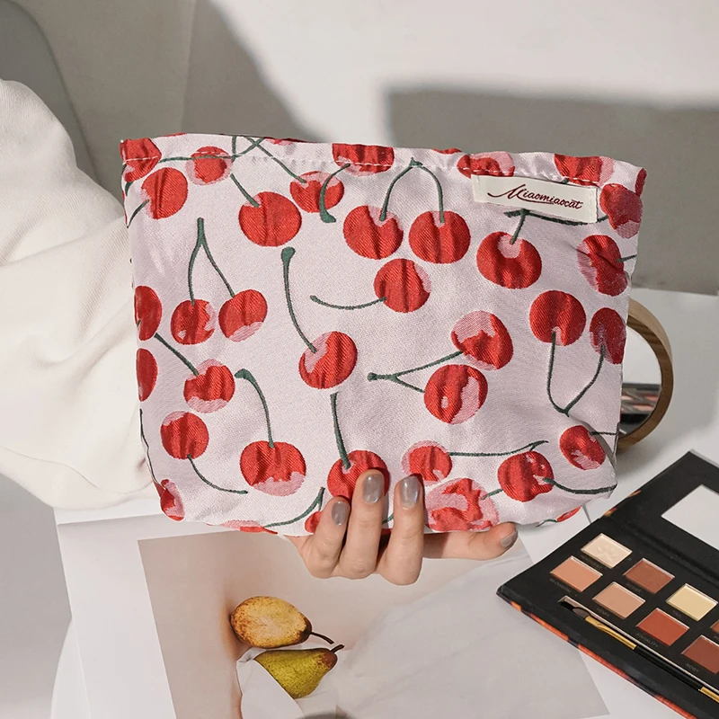 Hot sale Cute and fresh artistic red cherry makeup bag portable skincare storage bag hand-held bag coin purse