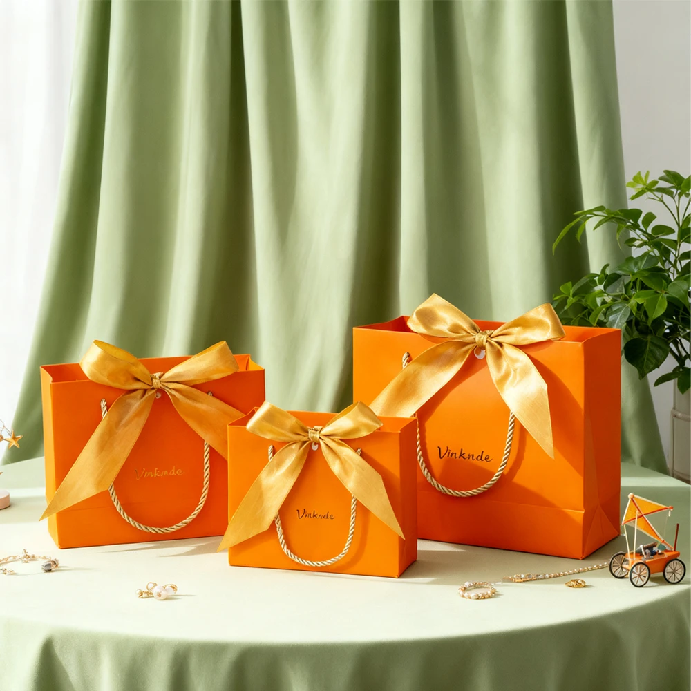 

50Pcs Custom Logo Portable Packaging Paper Tote Bag Clothing Jewelry Box Gift Bags with Gold Bow Ribbon for Wedding Birthday