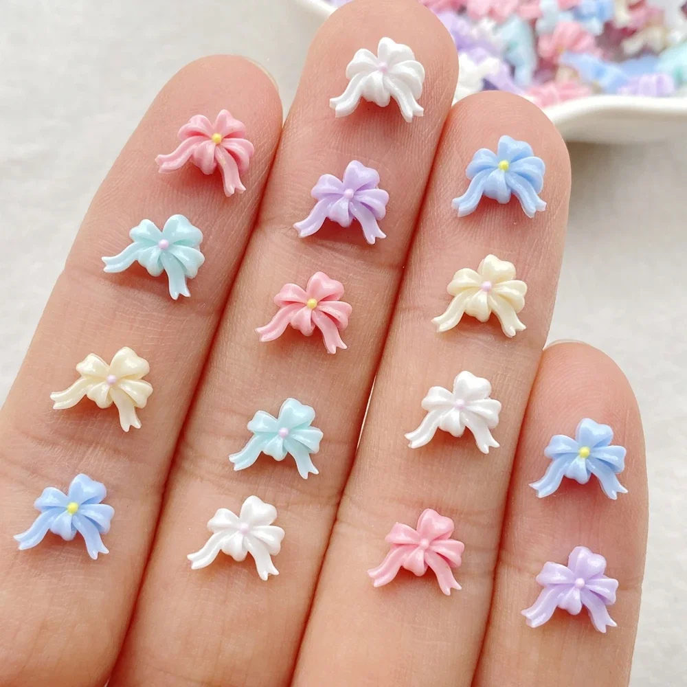 100 ชิ้นผสมสีสันโบว์ริบบิ้นเล็บแบน Rhinestone ลูกปัดสมุดภาพ DIY เล็บ Appliques อุปกรณ์เสริมหัตถกรรม