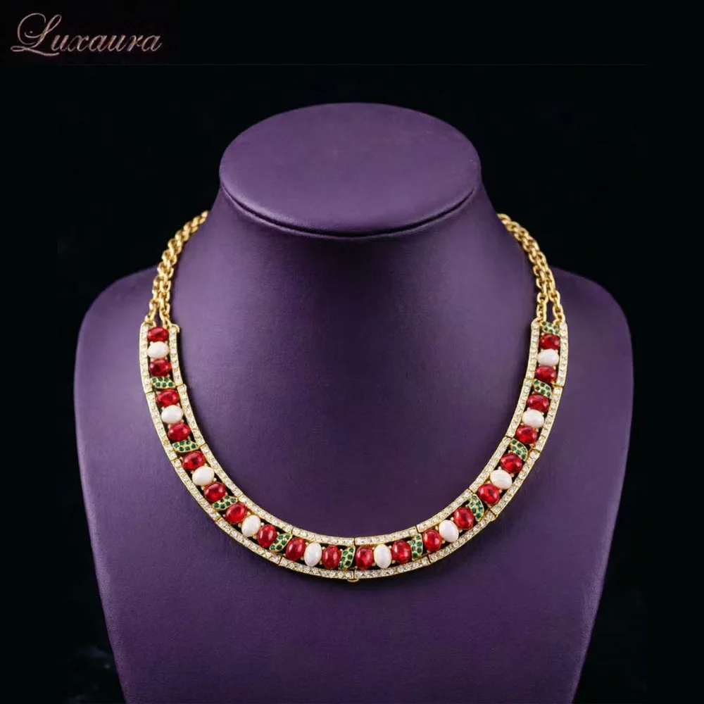 

Vintage jewelry featuring a fashionable and classic red geometric necklace design paired with Bohemian style women's necklace