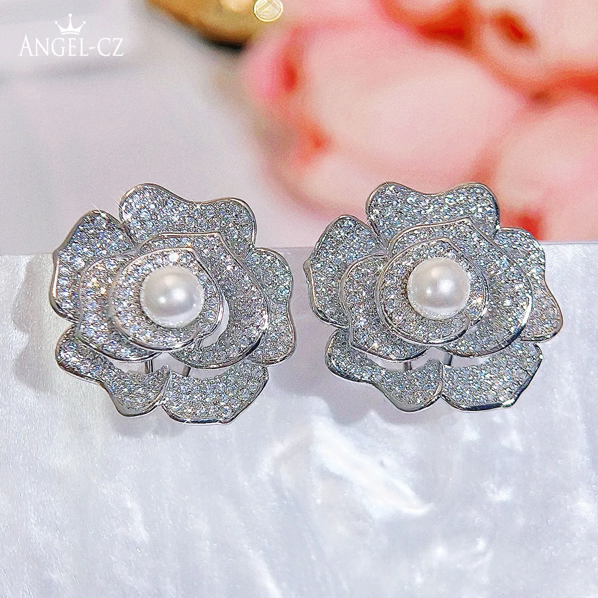 ANGELCZ Expensive Women Jewelry White Gold Color Dancing Pearl Stud Earrings Pave Tiny Sparkling Zirconia Ear Decoration AE350