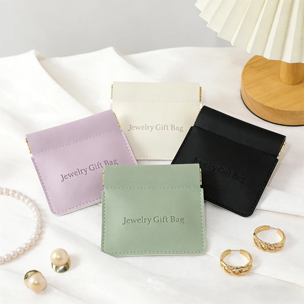 

Customizable PU Leather Squeeze Shrapnel Jewelry Pouch ​8X8.5cm Jewelry Packaging Seal Portable Earring Bag With Embossing Logo