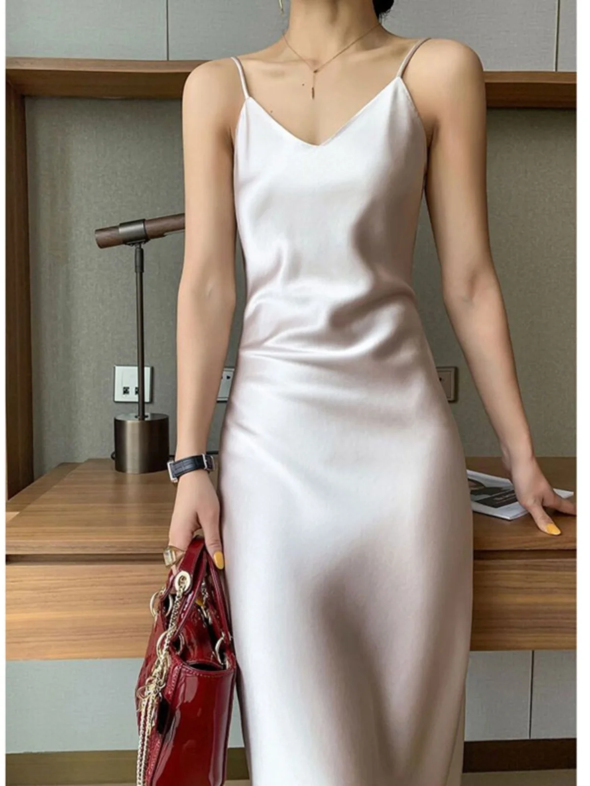 Silk suspender dress women's new temperament simple imported acetic acid satin V-neck waist A-shaped skirt