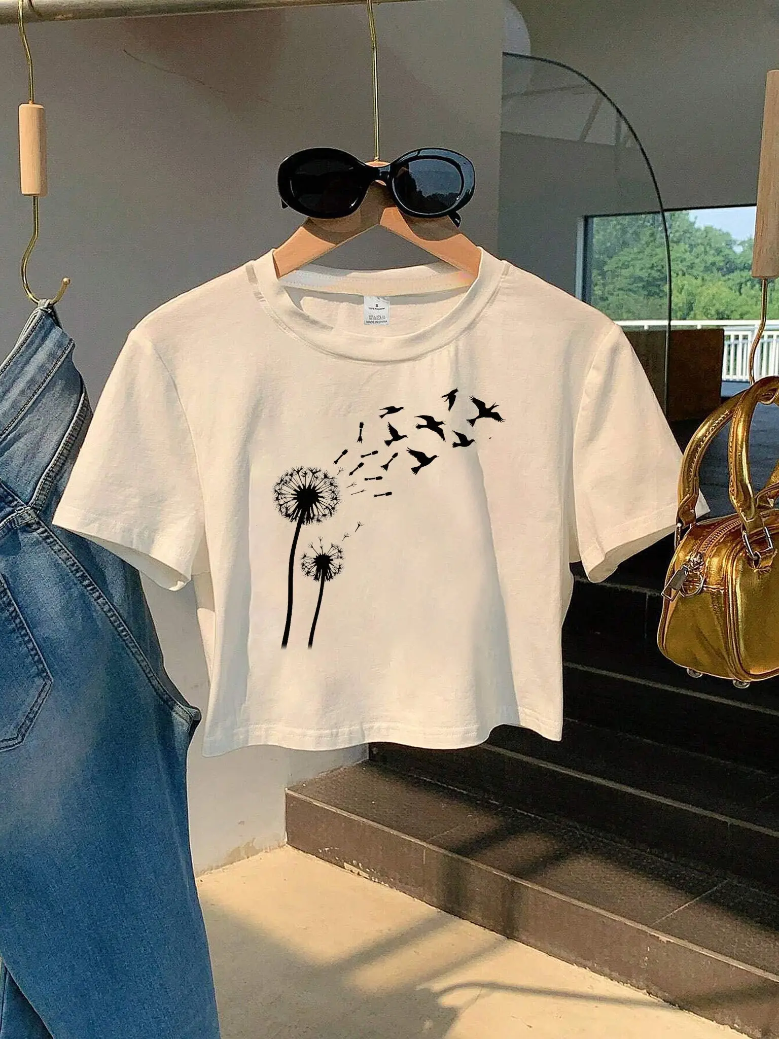 White Cropped T-Shirt Featuring A Black Dandelion with Two Stems Puffs Seeds and Silhouettes of Black Birds Aesthetic Clothes