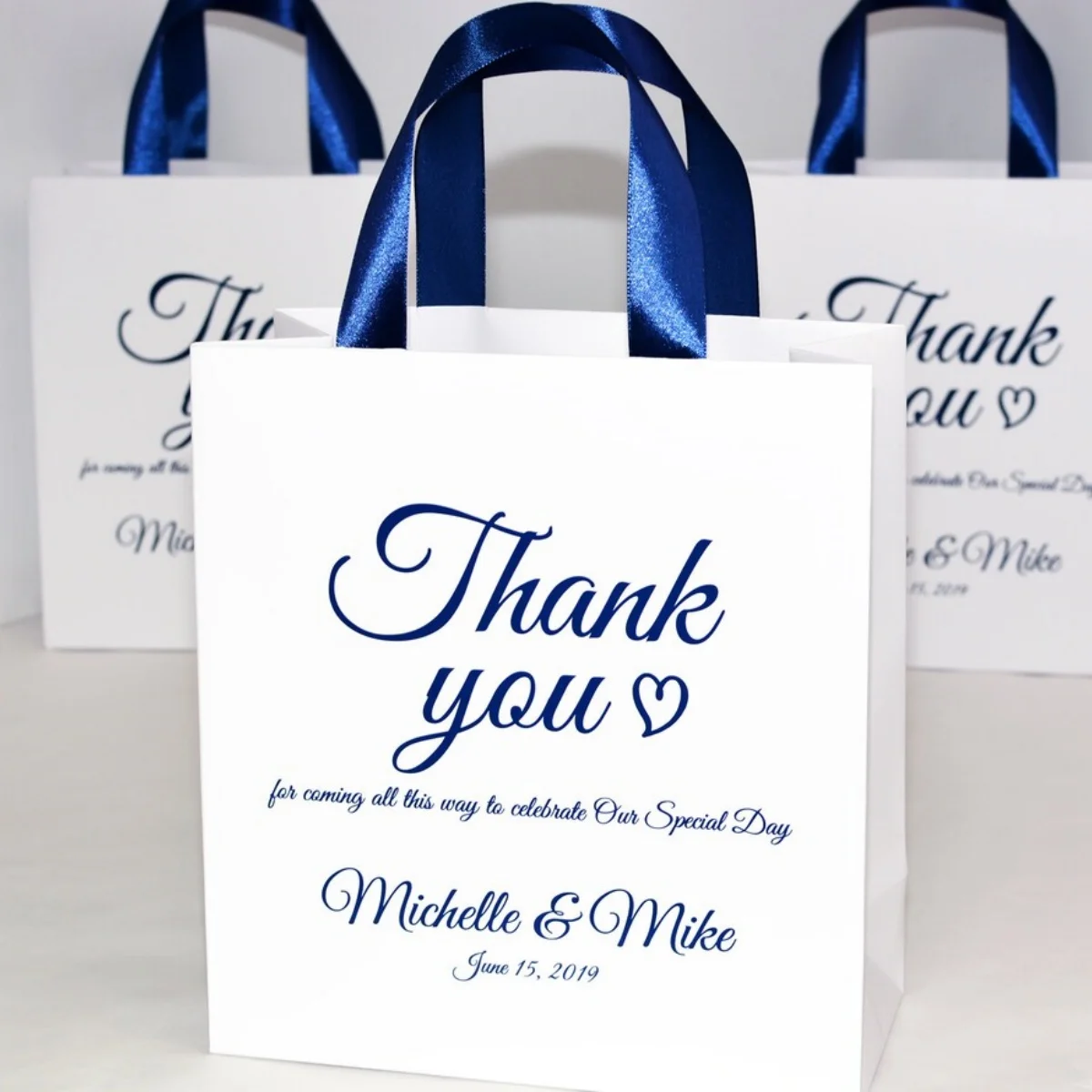 

Navy Blue Personalized Wedding Welcome Bags with satin ribbon handles and names, Elegant Wedding Thank You favors for guests