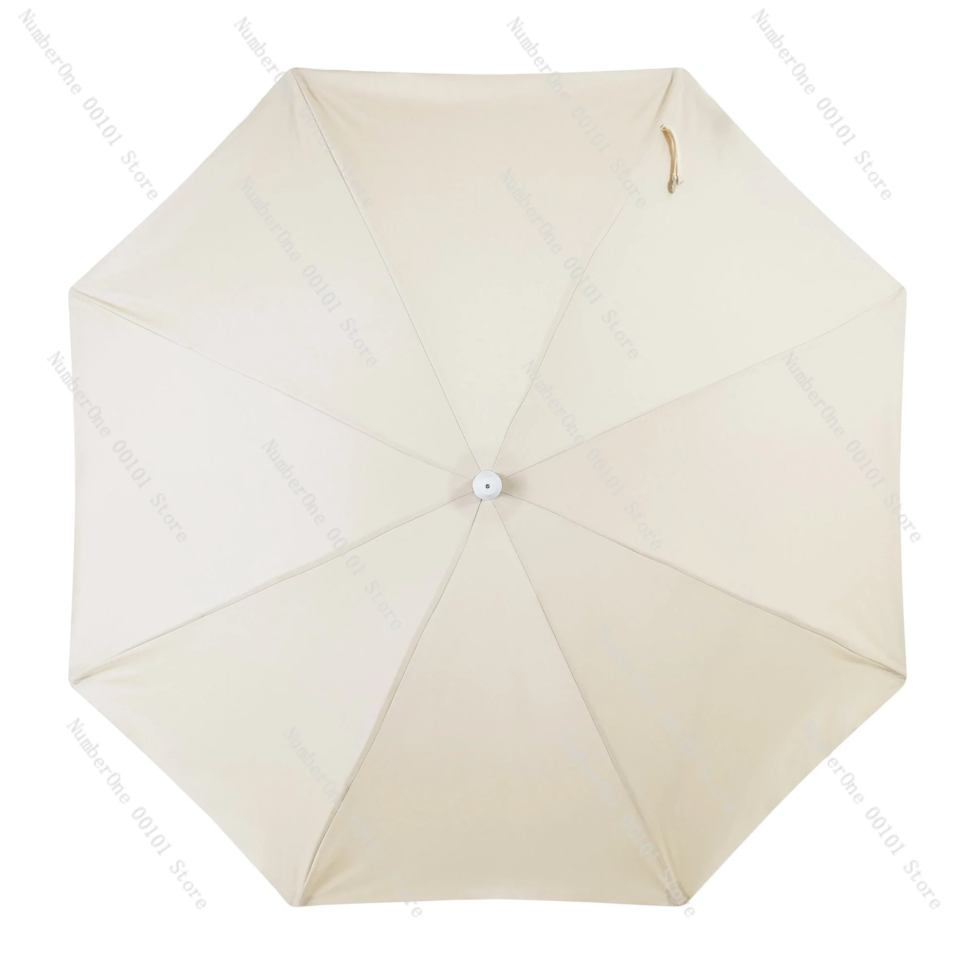 white beach umbrella with tassels