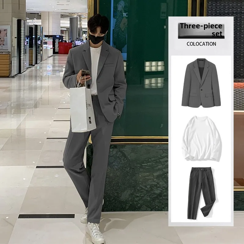 Dark gray three-piece suit