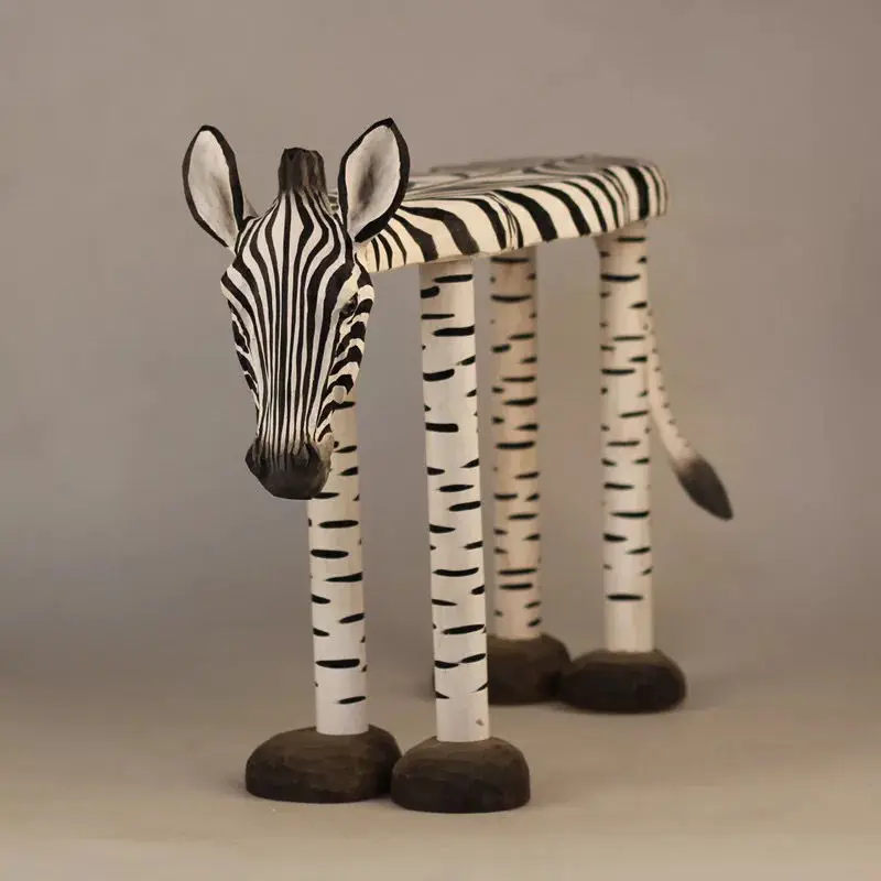 Hand-carved zebra with solid wood for shoes and benches.