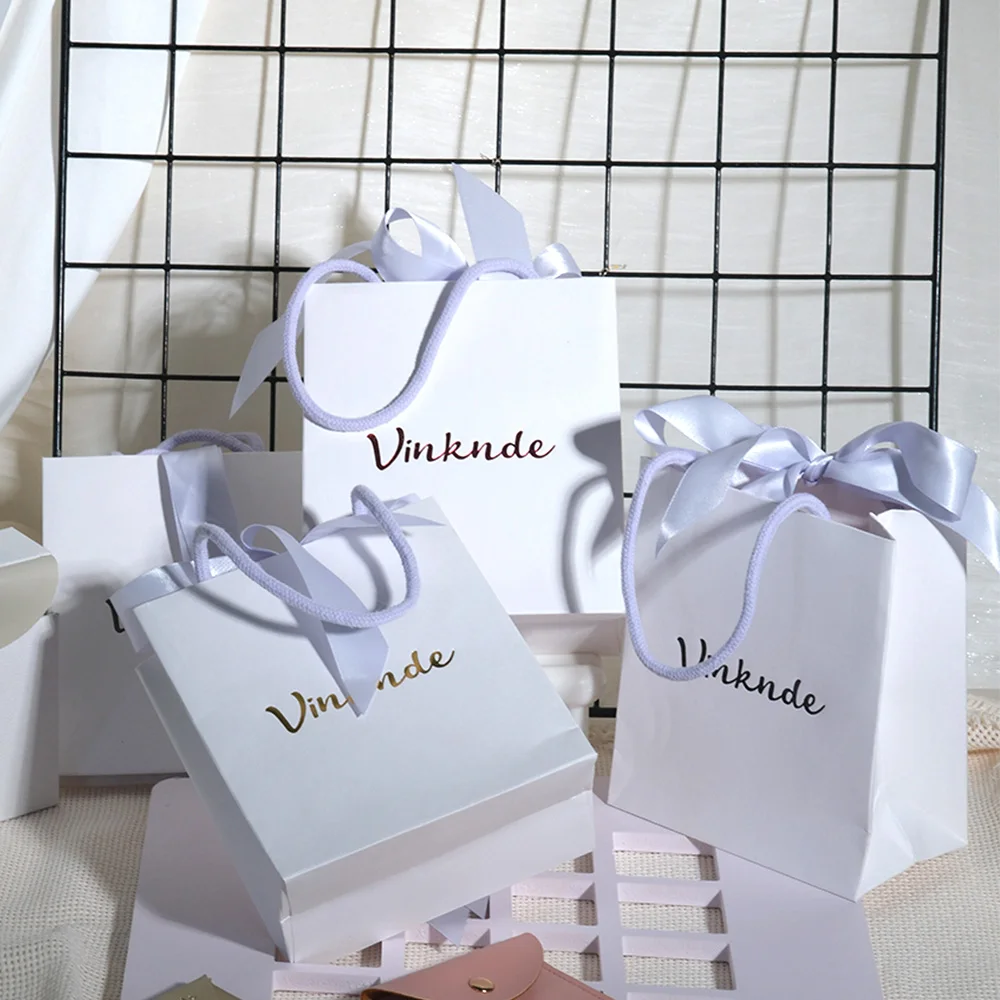 

New Arrival Bow Tie Paper Bag Personalized Logo Shopping Wedding Gift Packaging Bag Luxury Jewelry Perfume Cosmetic Storage Bags