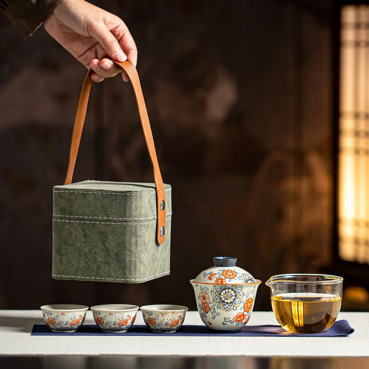Blue white flint and red ingot covered bowl, one pot three cups, wrapped with lotus and treasure phase, travel portable tea set