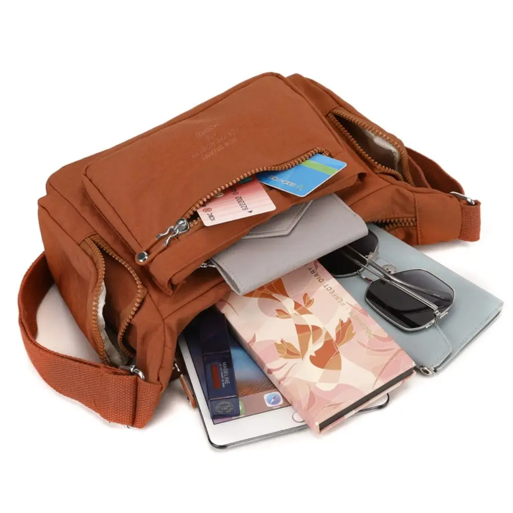 

Portable Nylon Crossbody Bag Solid Color Lightweight Multipockets Shoulder Bag Fashionable Adjustable Strap Middle Aged Tote Bag