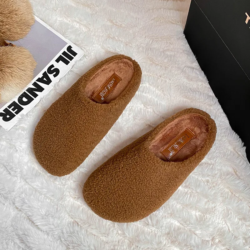 

Women Wearing Autumn and Winter Bags with One Foot on The Head and Warm Cotton Shoes with Plush and Fluffy Half Slippers