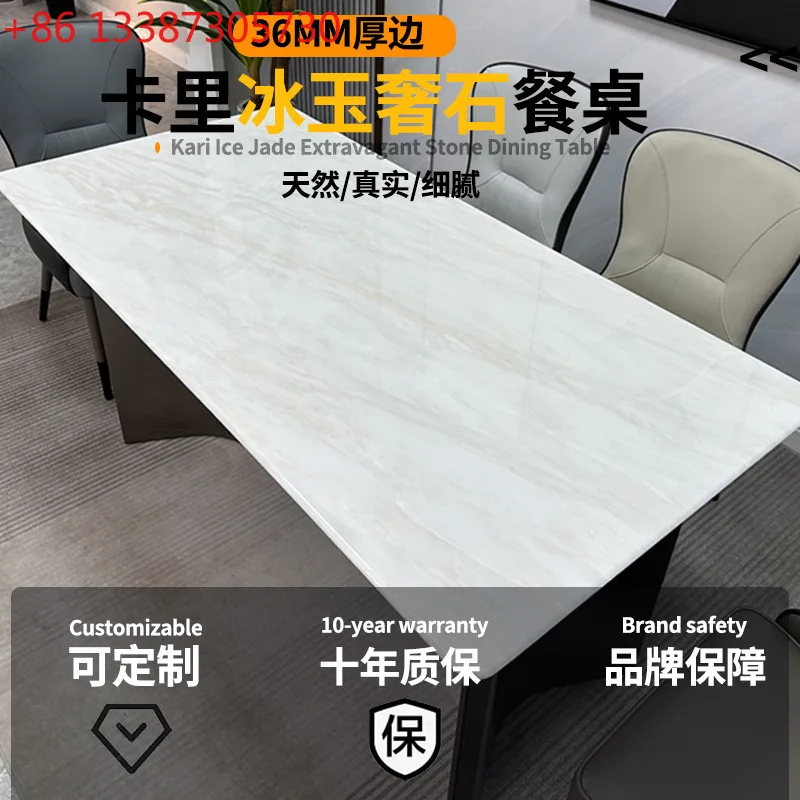 

Обеденный стол из натурального мрамора, цвета белого льда, роскошный, из итальянского камня, прямоугольный, светлого оттенка.