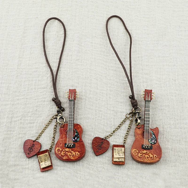 

Genuine leather folk guitar bag pendant keychain car hanging decoration vintage literary instrument handmade leather accessory