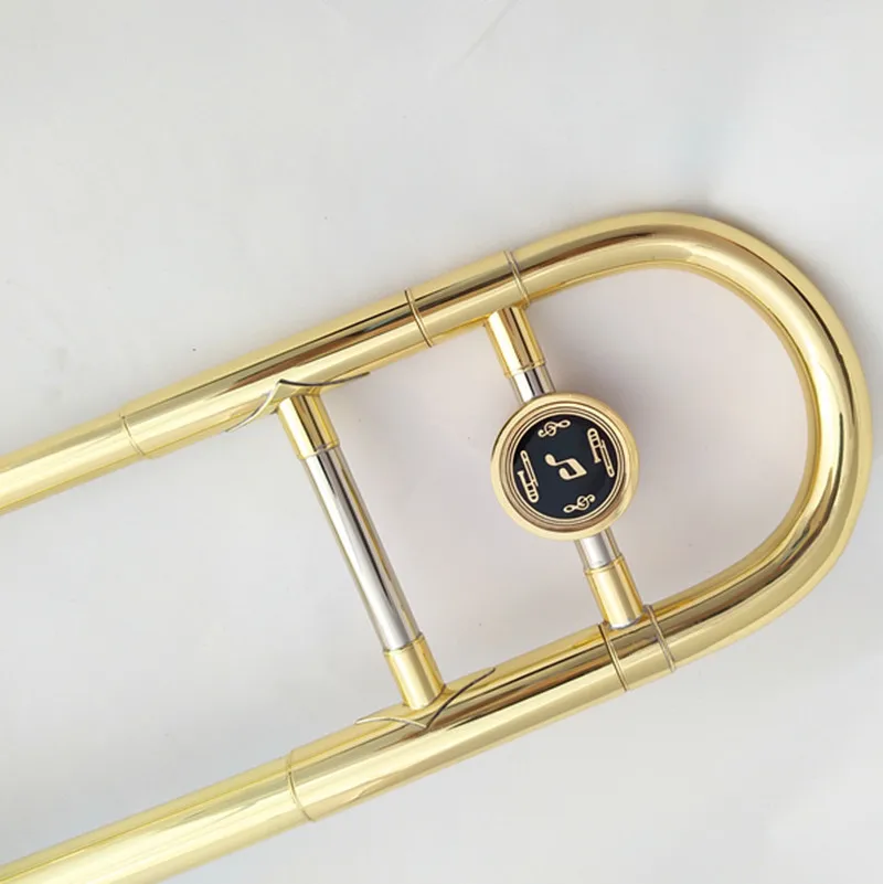 A brass lacquered gold trombone instrument with case in the flat B tone of the baritone