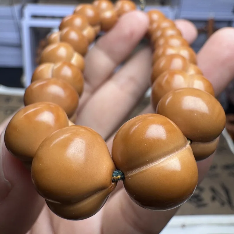 Manufacturer wholesale of hand-carved beads Beijing octagonal monkey head walnut single-strand bracelet 15mm
