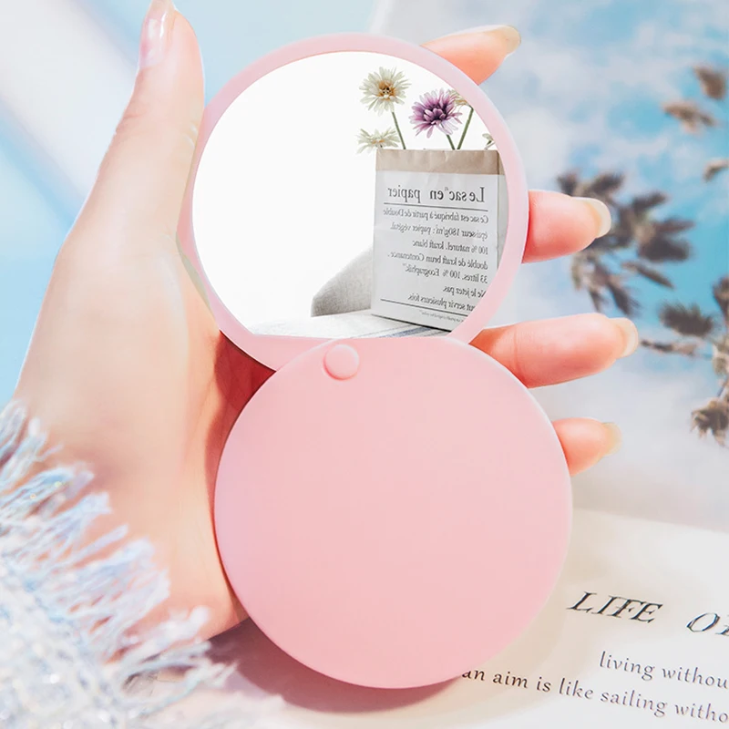 Round single-sided pocket folding mirror HD small mirror portable mini cosmetic mirror hand-held rotating slide mirror.