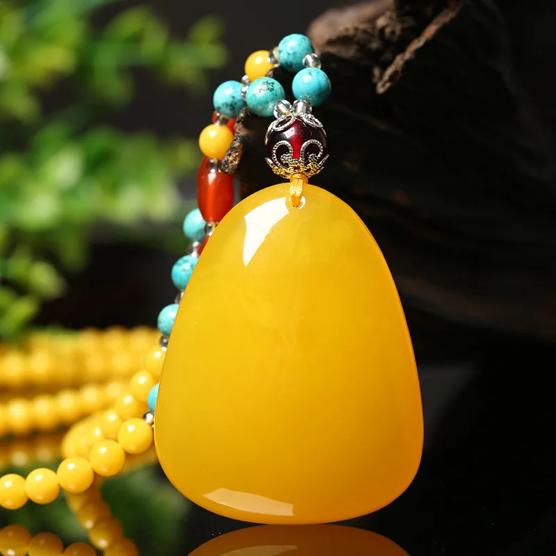 Chicken oil yellow old pendant for women, amber necklace, water drop freeform sweater chain, unisex jewelry