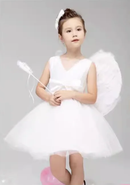 

Magical Fairy Performs White Swan Dance with Wings in a Fluffy Dress