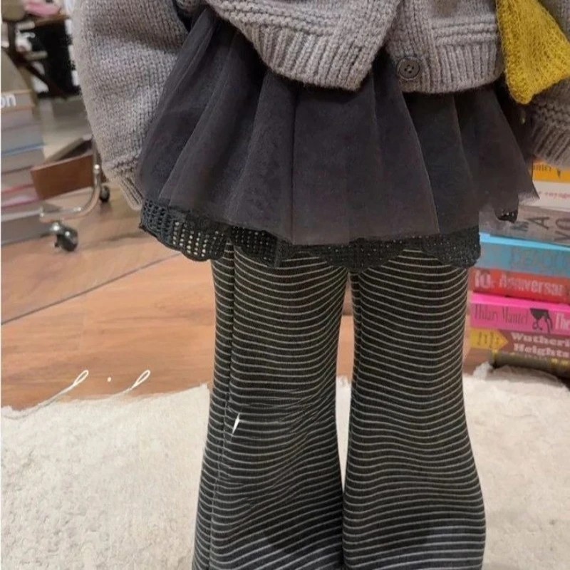 Girls bell bottom pants winter 2026 new baby fake two-piece velvet ballet style striped fart curtain pants baby skirt