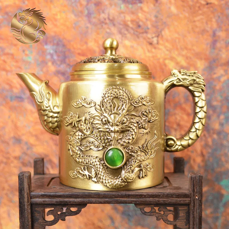 All-brass dragon phoenix figurine with red green gemstones, a decorative teapot, a collectible copper pot, and a