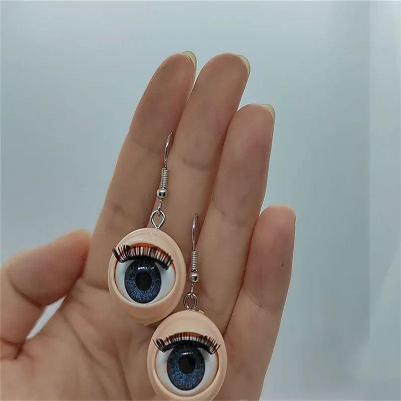 Awful creepy doll eyeball earrings with awful blinking action weirdos