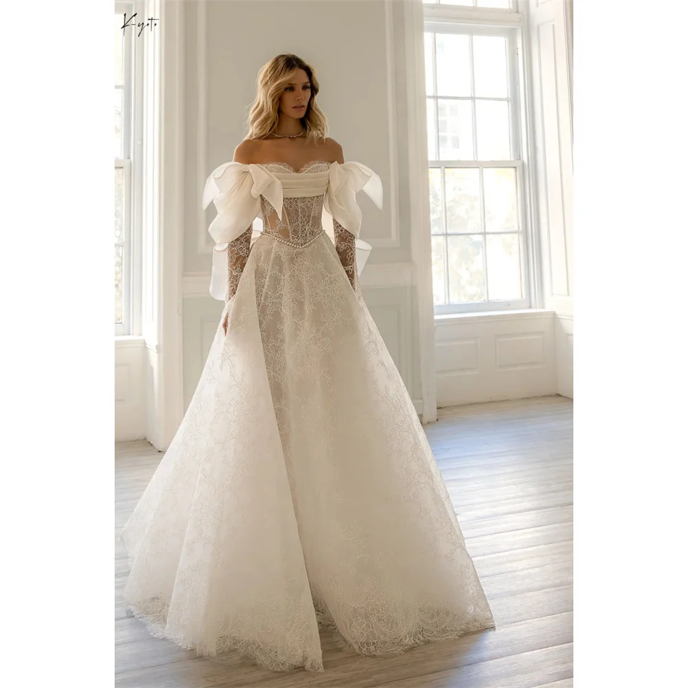 فستان زفاف كيوتو مخصص باللون الأبيض قبالة الكتف من الدانتيل مع فيونكة وأكمام طويلة على شكل حرف a ذيل محكمة للسهرات الرسمية #1