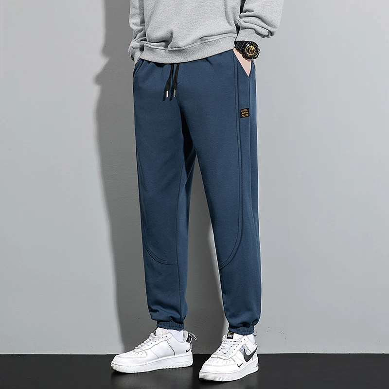 Fashion Solid Color Pockets Spliced Casual Pants Men's Clothing 2024 Spring Autumn New Loose Elastic Lace Up High Waist Trousers