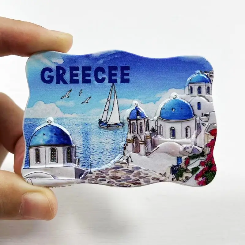 distinctive blue and white circular building of Santorini, Greece, is a magnetic refrigerator sticker, a high-value decorati