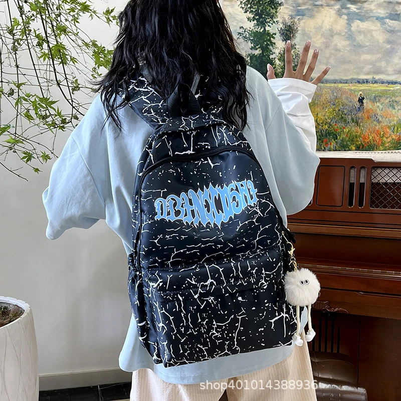 Women Crack Print Nylon Backpack With Pom Pom Pendant Graffiti Letter Decor Lightweight Casual School Travel Rucksack