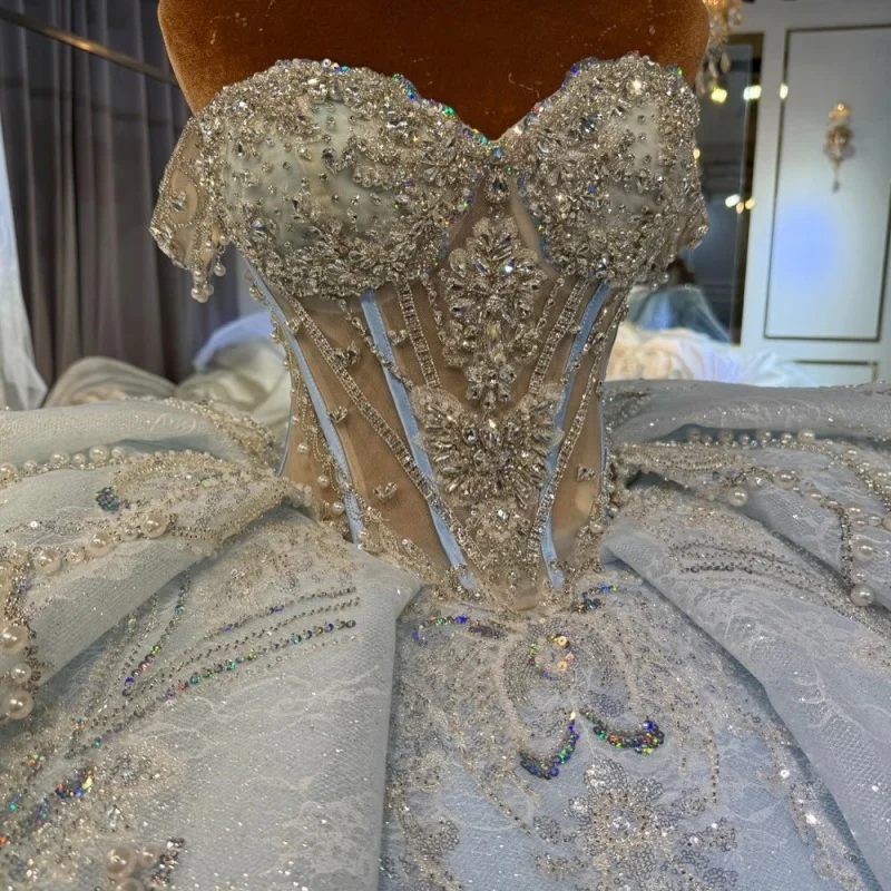 

Синее платье для церемонии Quinceanera с открытыми плечами, блестящими кристаллами, многослойной отделкой, длинным шлейфом и бантом, платье для 15-летия. ﻿ Индивидуальный заказ