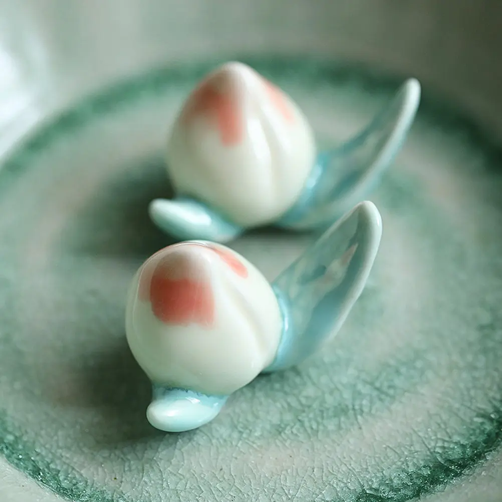 

2Pcs Small Size Peach Shaped Ceramic Chopsticks Rests Elegant Smooth Surface Non Slip Chopstick Holders Spoon Fork Supports