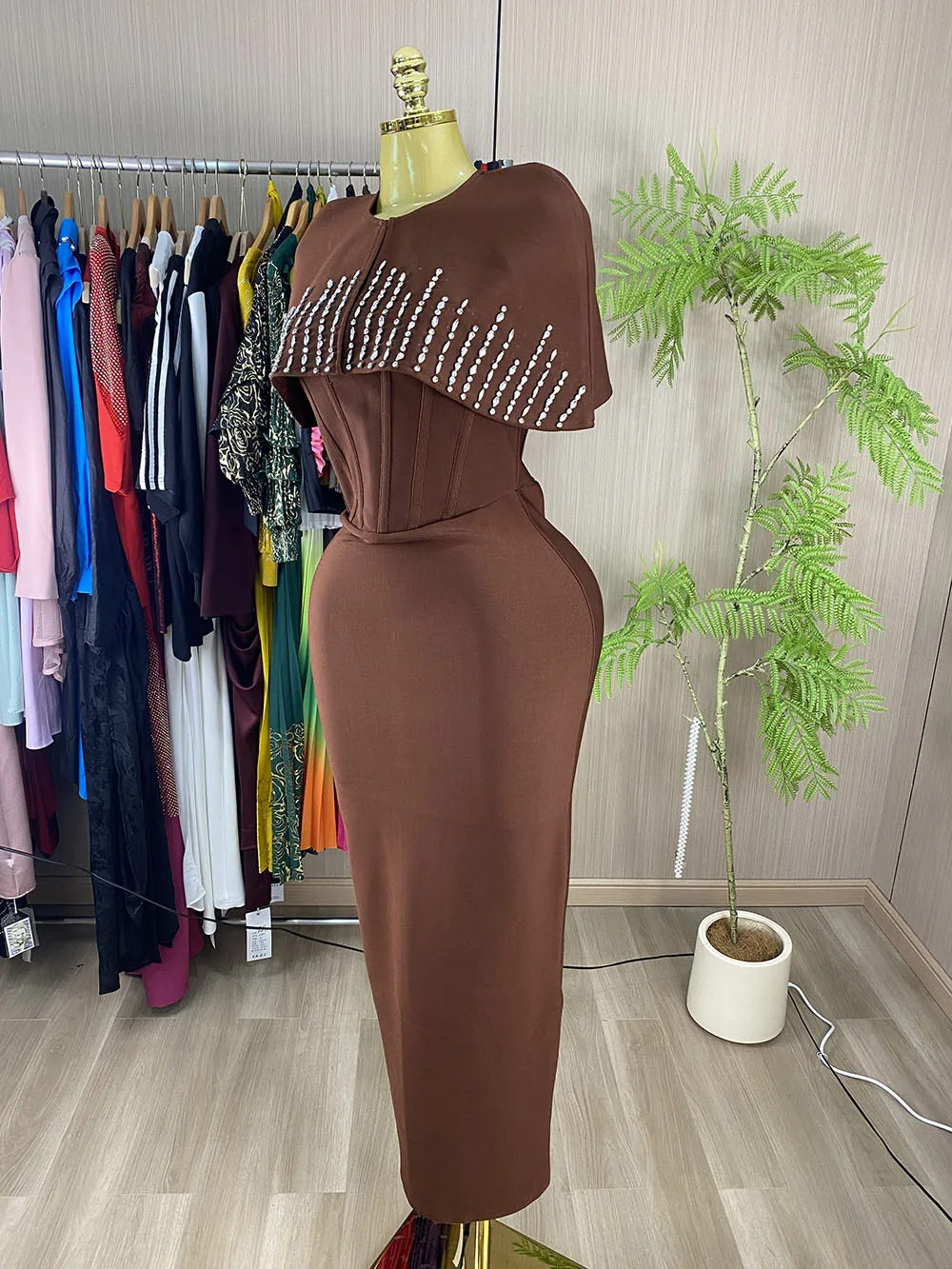 Sleeveless, sexy, lace-up evening gown featuring rhinestone embellishments and a cape-style design.-GZXX1167