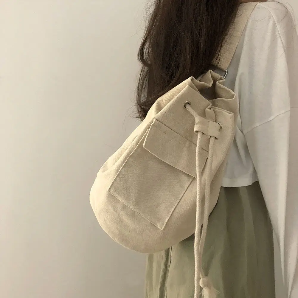 

Korean ins spring 2022 with pocket canvas drawstring bucket bag inclined span single shoulder high-capacity men and women