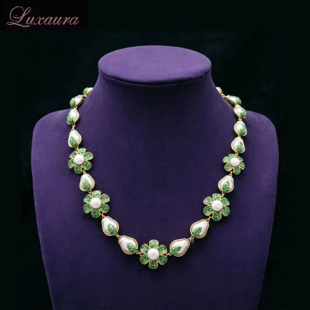

Vintage jewelry featuring a fashionable and classic green geometric necklace design paired with Bohemian style women's necklace