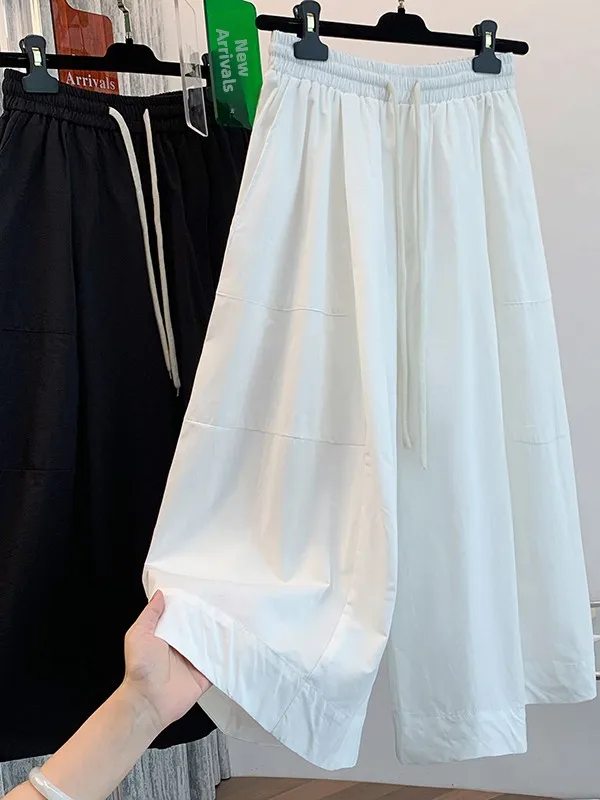 ゆったりとしたワイドレッグパンツ、怠惰なスタイル、ルーズカフ、薄い夏のカジュアルな七分丈スカート、女性用プラスサイズのズボン、快適なフィット感