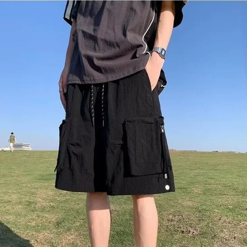 Pantalones cortos sueltos para hombre, pantalones cortos anchos con bolsillos y cordón, pantalones cortos Cargo lisos para hombre, ropa holgada con cintura elástica, Jorts de diseñador de lujo