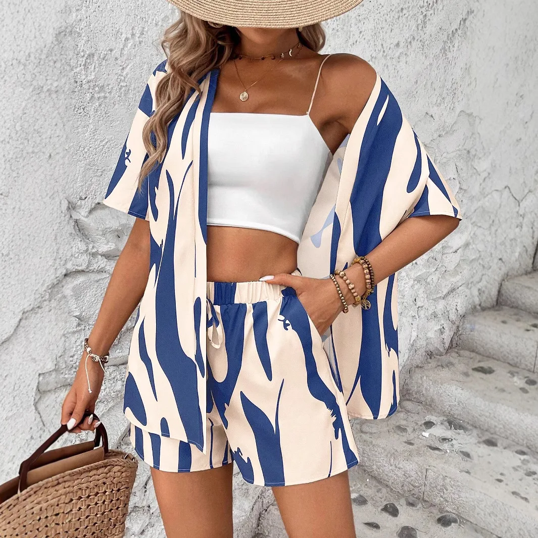 

2025 New Boho-Chic Beach Set: Cropped White Spaghetti Top Navy/Cream Abstract Print Shorts & Kimono Jacket w/ Straw Accessories